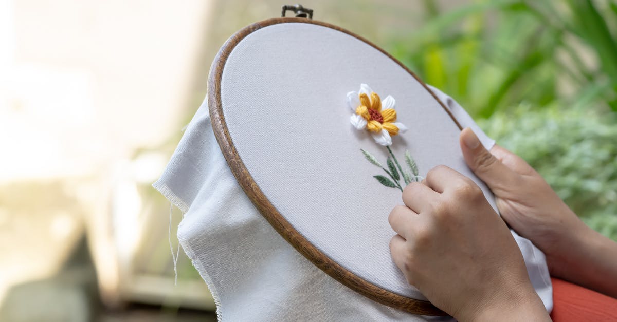 How to stitch up filled fish? - Person Doing Embroidery on White Cloth