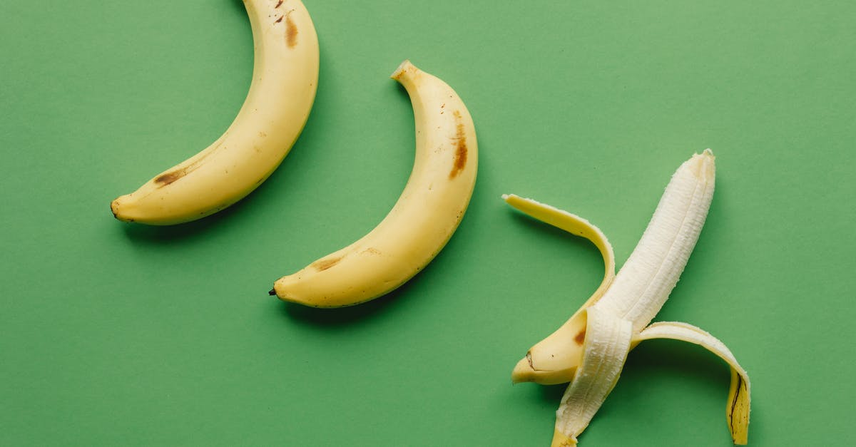 How to stop frozen bananas making everything else in the freezer taste like banana? - Ripe bananas on green surface