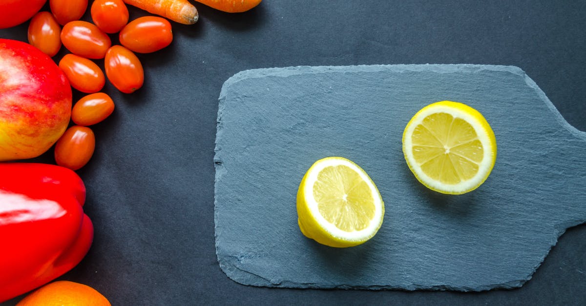 How to store cut fruits & vegetables for days? - Sliced Lemon on Blue Chopping Board