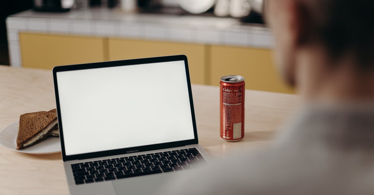 How to store Soda Water or other Home Made Sodas? - Red Can Beside Macbook Pro on Table