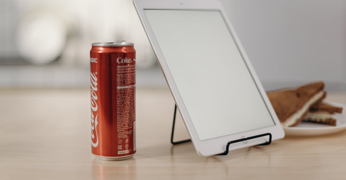 How to store Soda Water or other Home Made Sodas? - White Tablet Computer Beside Red Coca Cola Can