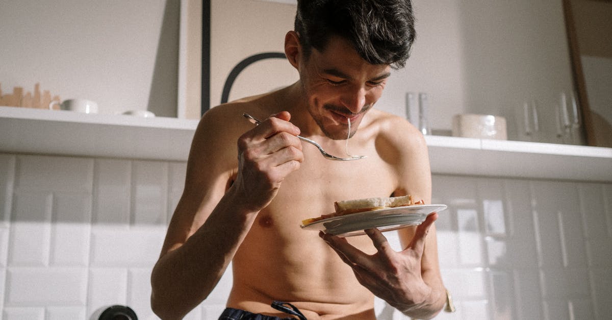 How to succeed with making omelette - Topless Man in Blue Denim Shorts Holding White Ceramic Plate