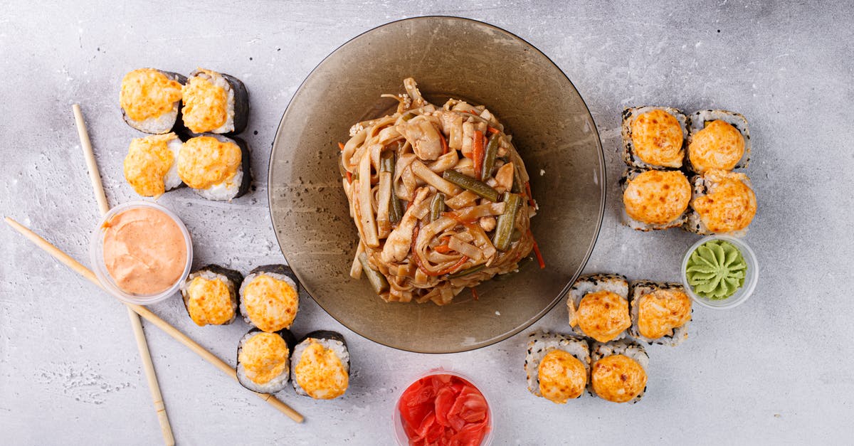 How to sweeten pickled ginger to be served with sushi? - Appetizing Asian noodle and sushi rolls arranged on gray table