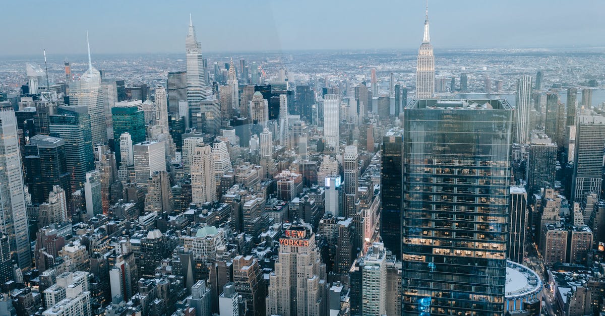 How to taste a real ranch dressing outisde of the US - Drone view of modern high rise buildings and residential houses located on street of New York City against cloudless sky