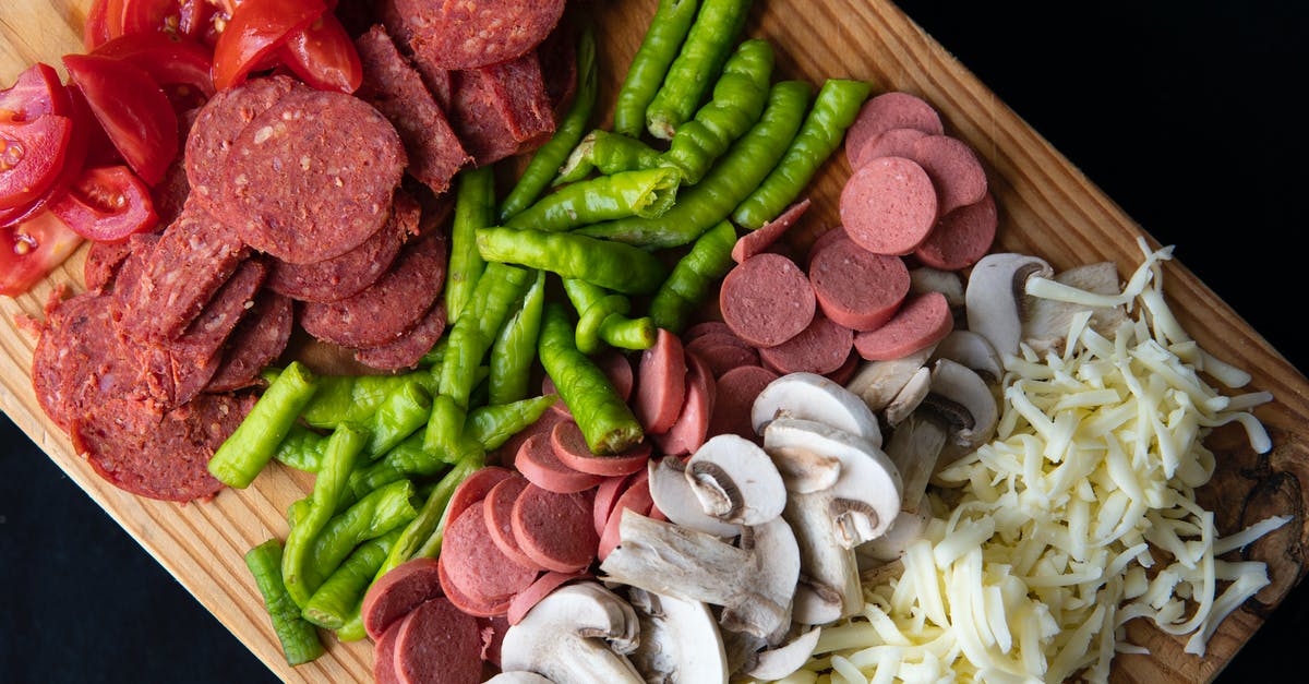 How to tell pre-sliced, raw mutton from beef? - Sliced pizza ingredients on chopping board