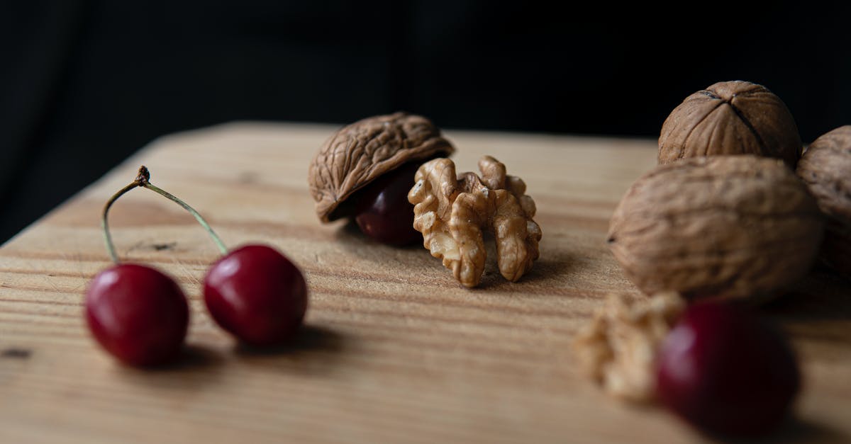 How to thin half and half to substitute for milk? - Crunchy walnuts and sweet cherries on cutting board