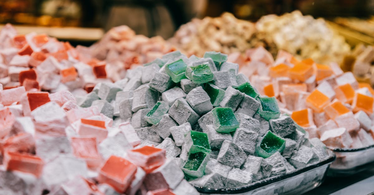 How to tint powdered sugar (icing sugar)? - Assortment of sugar starch cubes sprinkled with powdered sugar