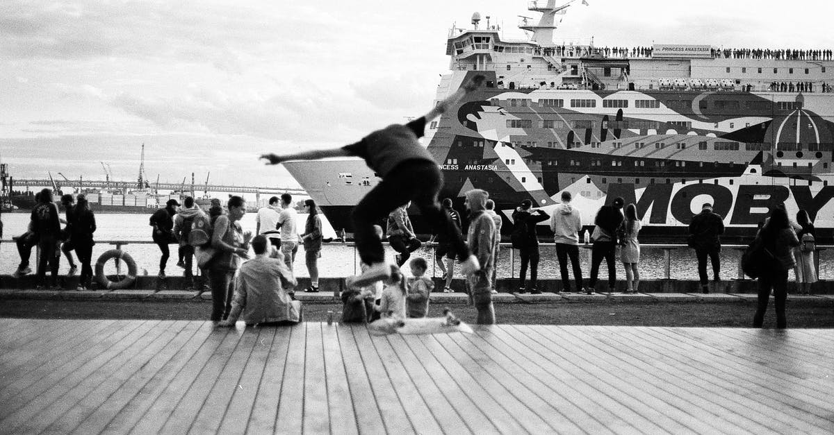 How to transport several pies? - Grayscale Photo of People on Pier