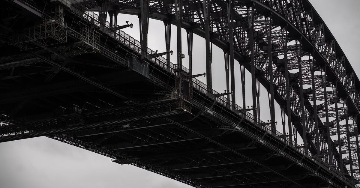 How to truss a chicken? - Black and white from below famous Sydney Harbor Bridge with arch trusses beneath gloomy sky