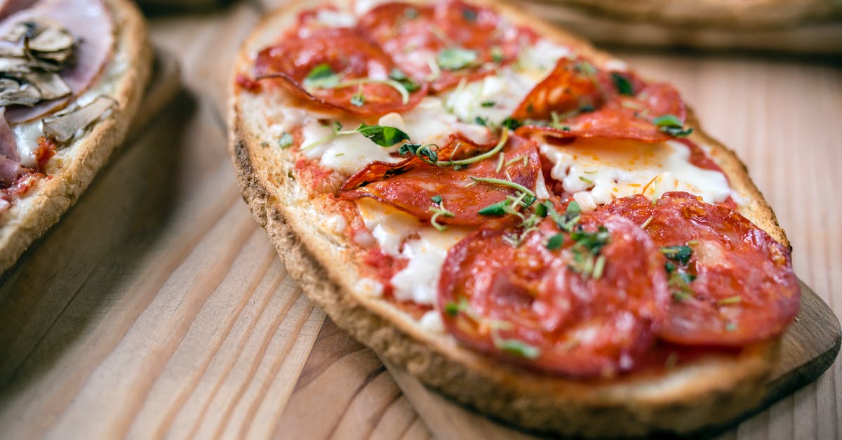 How to turn a large piece of meat without losing breading - Tasty toast with pepperoni slices on cutting board