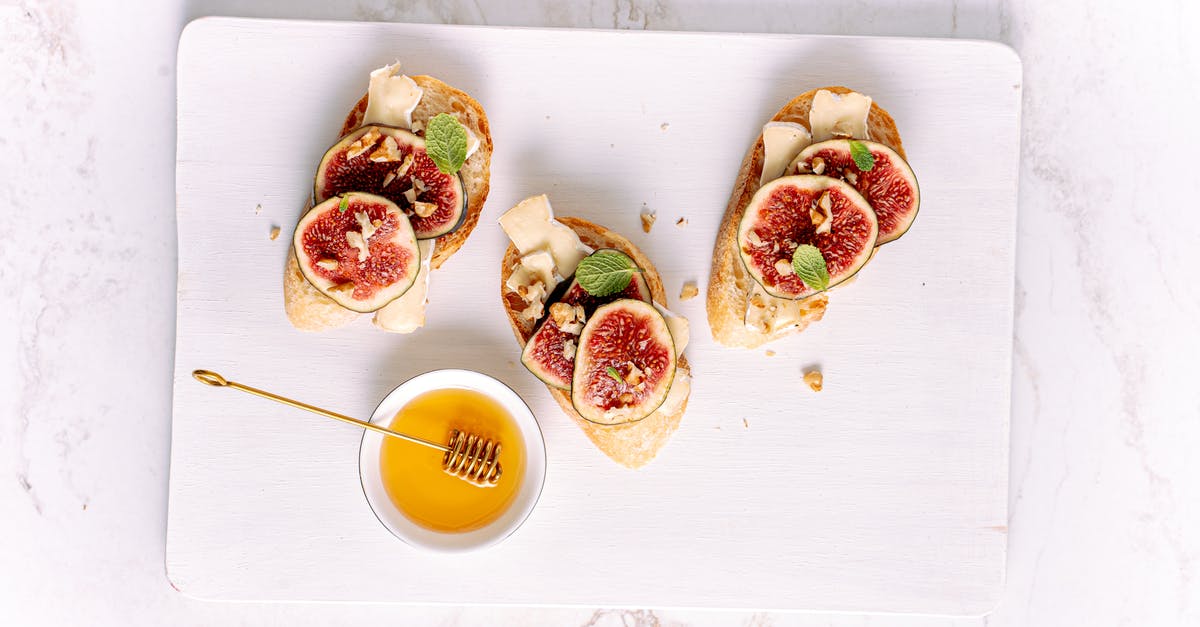 How to use a honey dipper? - Breads with Toppings on a White Tray
