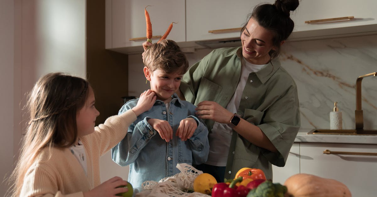 how to use CSA vegetables most efficiently - Woman in White Long Sleeve Shirt Holding Boy in Blue Long Sleeve Shirt