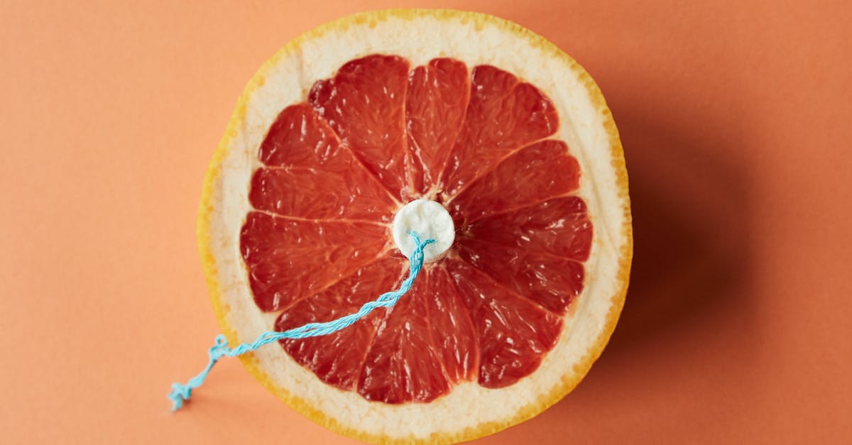 How to use gelatin on fruit pie? - Sliced grapefruit with tampon as symbol of menstruation