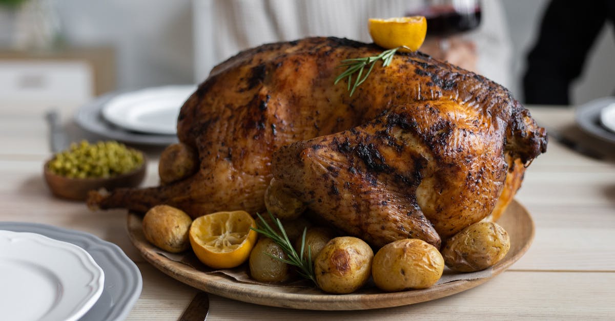 How to use meat thermometers with big needles for thinner meat pieces? - From above of big turkey roasted with lemon and potatoes on round wooden tray placed on table for celebrating Thanksgiving Day