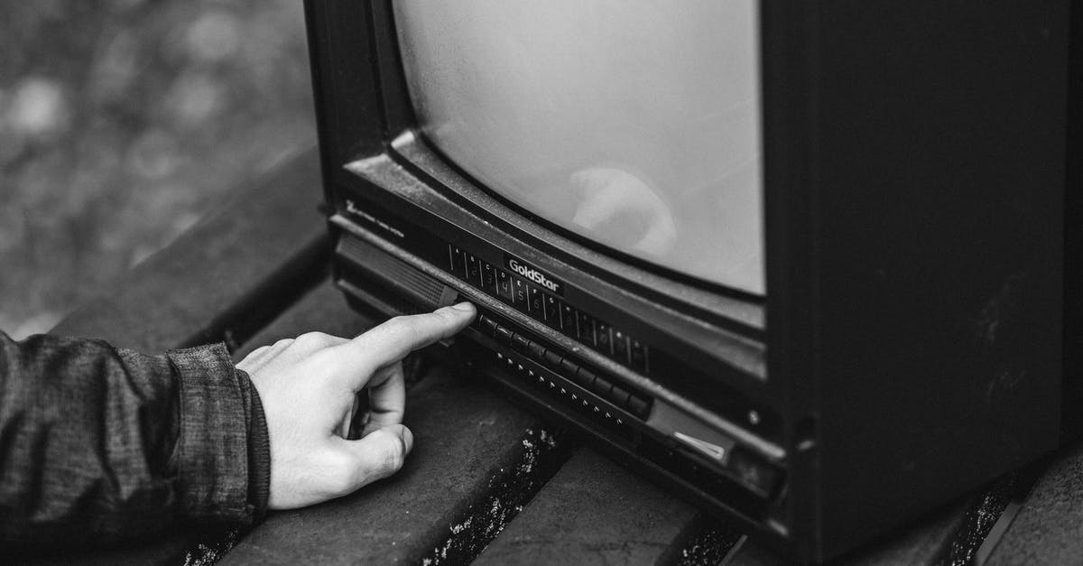 How to Use Ravioli Maker without Press Insert - Black and white of unrecognizable male pressing buttons on old fashioned television placed on wooden table in nature on blurred background