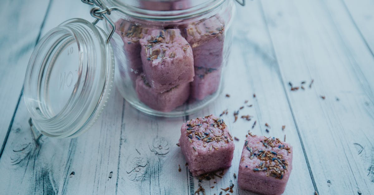 How to wash fresh fish properly to reduce its smell? - Aromatic purple bath bombs in glass jar arranged on white table