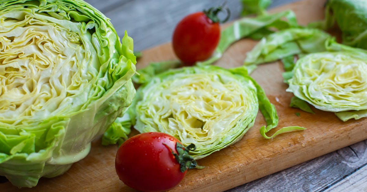 How to wash lettuce - Fresh washed iceberg lettuce and tomatoes on cutting board