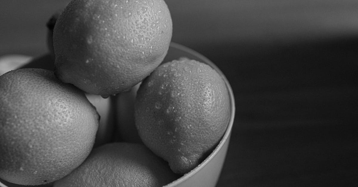 How to wash pesticides from fruit skins? - Pile of fresh wet lemons in bowl