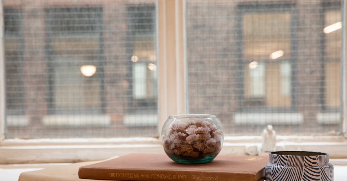 How to whip up a small quantity of Italian meringue? - Small Flowers on a Glass Bowl on Top of Stacked Books