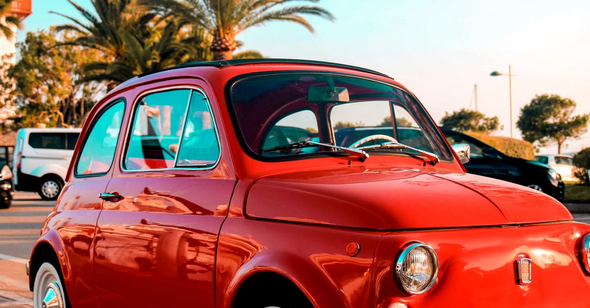 How to whip up a small quantity of Italian meringue? - Vintage small red car parked on roadside near tropical palm trees against cloudless blue sky