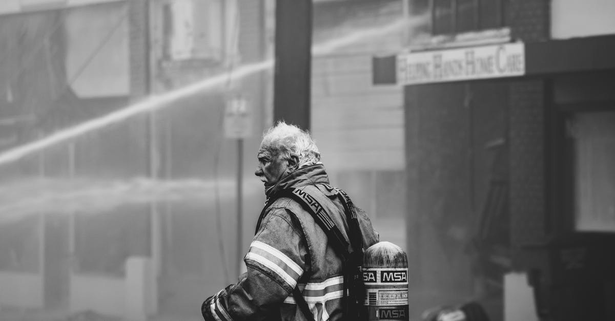 I added more water to my ciabatta dough by accident - Grayscale Photo of Firefighter