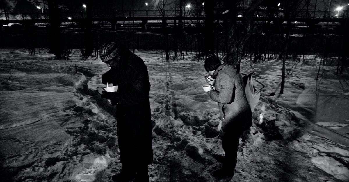 I need a substitute for acids in my food. - Homeless people eating food in winter park