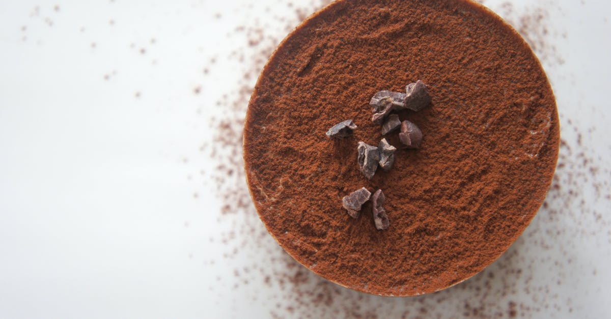 I need to convert cocoa powder into unsweetened chocolate squares - Close-up Photography Of Cocoa Powder