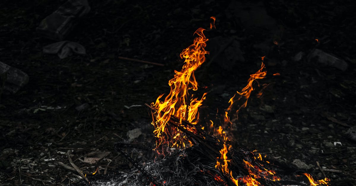 Ice-cream-on-a-stick in refrigerator temperature - Burning bonfire in evening time