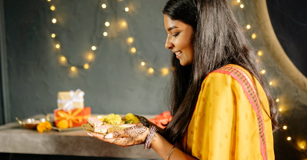 Identify this dessert - Woman in Yellow Dress Eating