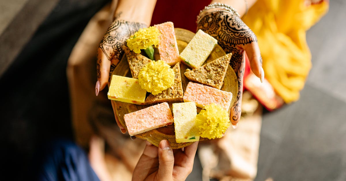 Identify this dessert - Person Holding Brown and Green Box