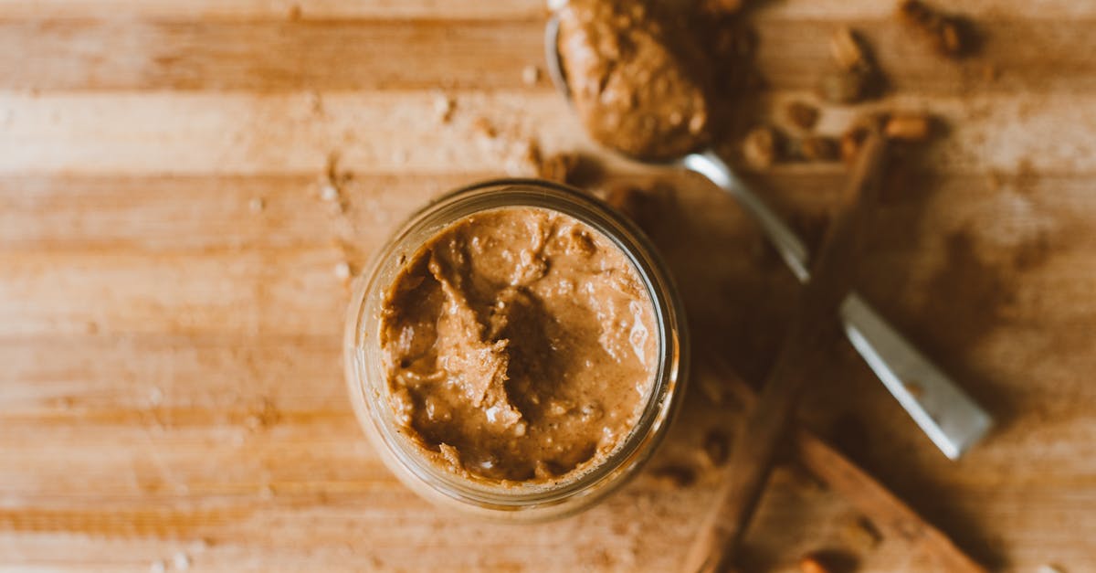 If I put peanuts in a coffee grinder, will I get peanut butter or peanut powder? - Peanut Butter in Clear Glass Jar