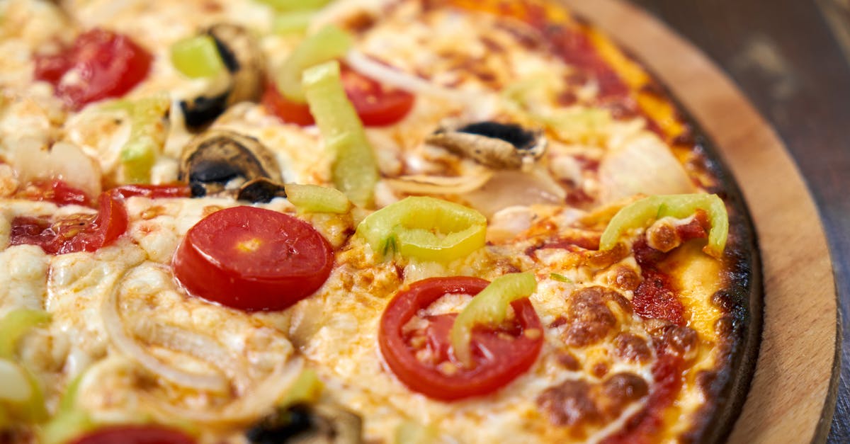 Imported Italian canned tomatoes vs. American tomatoes - Close-Up Photo Of Pizza