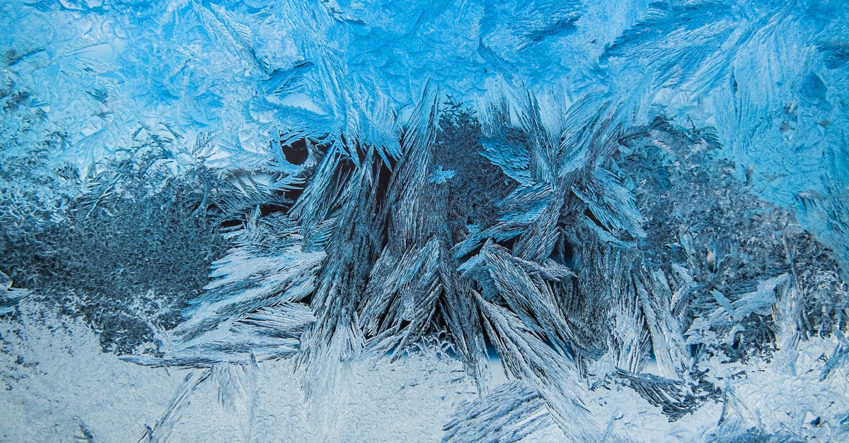 Improving texture of yogurt based ice cream- stabiliser? - Close-up of Ice Texture on Frozen Surface