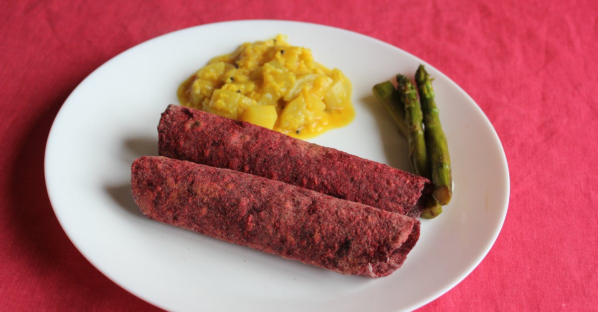 Indian Curry: Frying spices vs marinating the meat in them - Brown Sausage on White Ceramic Plate