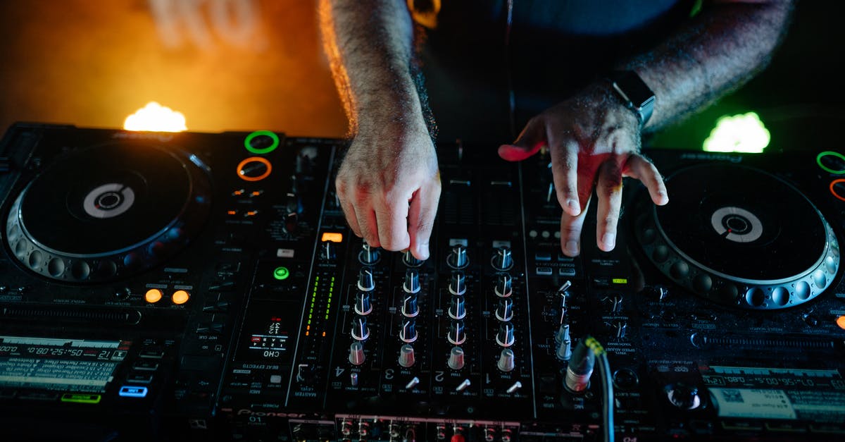 Induction unit makes buzzing sound - Person Holding Black Audio Mixer