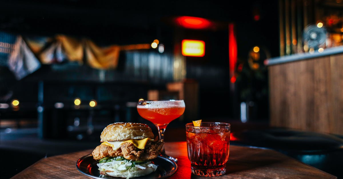 Ingredient to counter ammonia aroma/taste - Delicious hamburger with cocktails on table