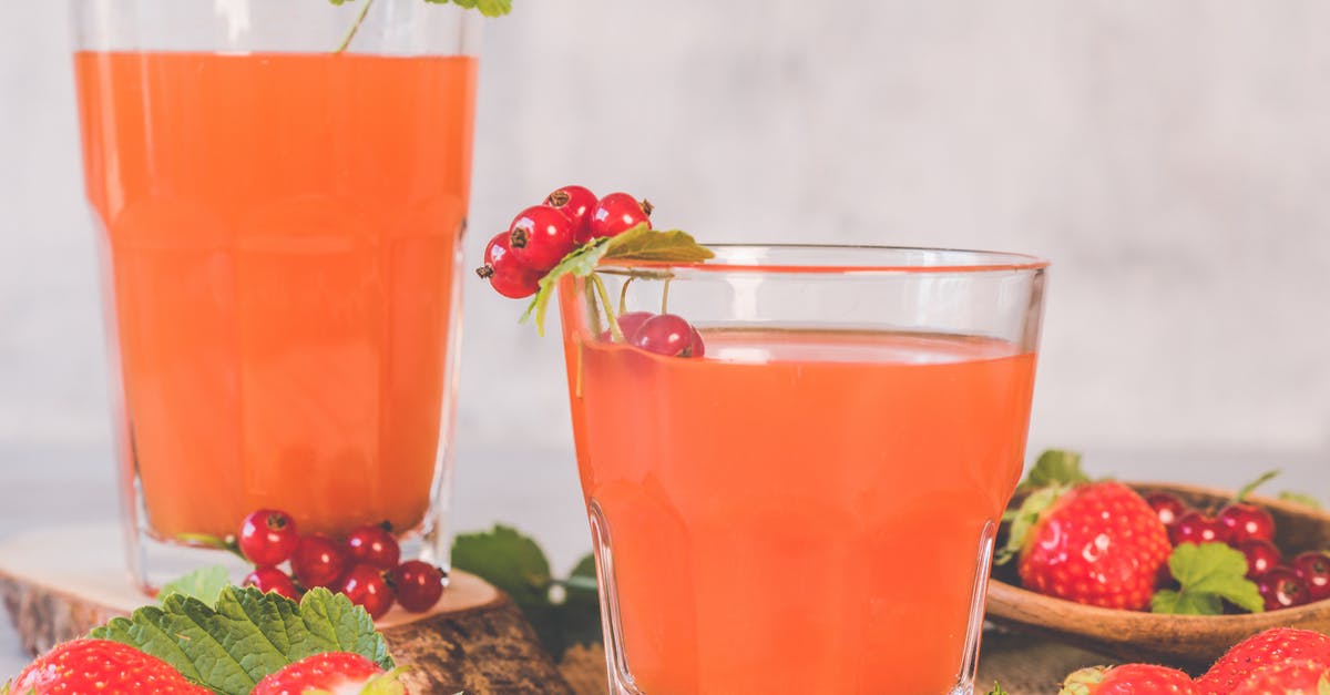 Ingredients for Cocktails - Two Clear Drinking Glasses With Strawberry Juice