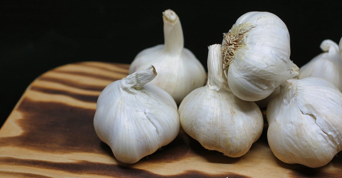 Ingredients of Root Beer - Garlic Bulbs on Brown Surface