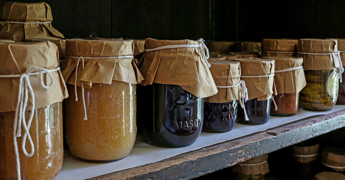 Inversion Canning - Brown Glass Jars on White Wooden Shelf