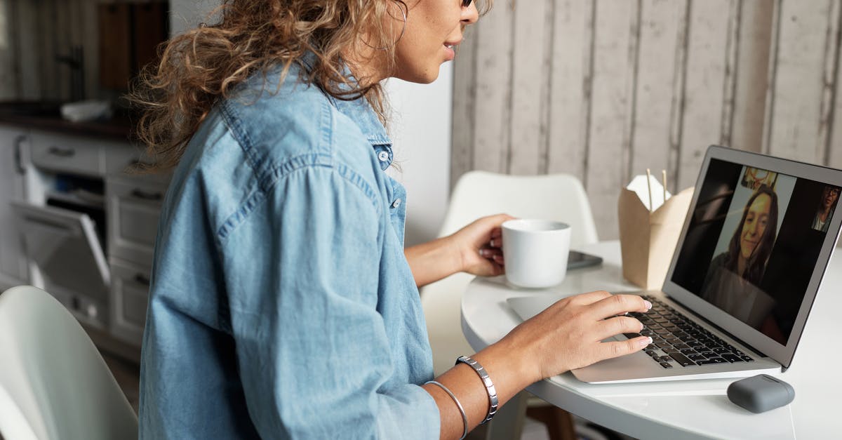 Is a portable Wok burner safe (indoors) - Woman in Blue Denim Jacket Using Macbook Pro