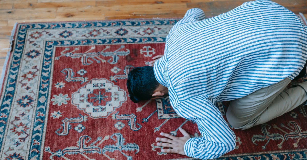 Is allspice traditional in the Levant? - Man in Blue and White Stripe Dress Shirt Bowing Down on Red and Blue Area Rug