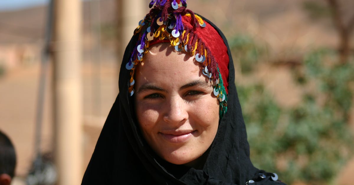 Is berbere supposed to be bitter? - Close-Up Shot of a Woman in Black Hijab Smiling