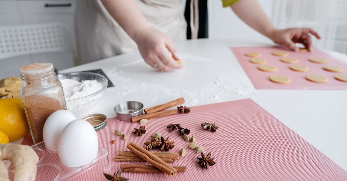 Is eating cookie dough without egg safe? - Crop woman preparing dough for Christmas cookies