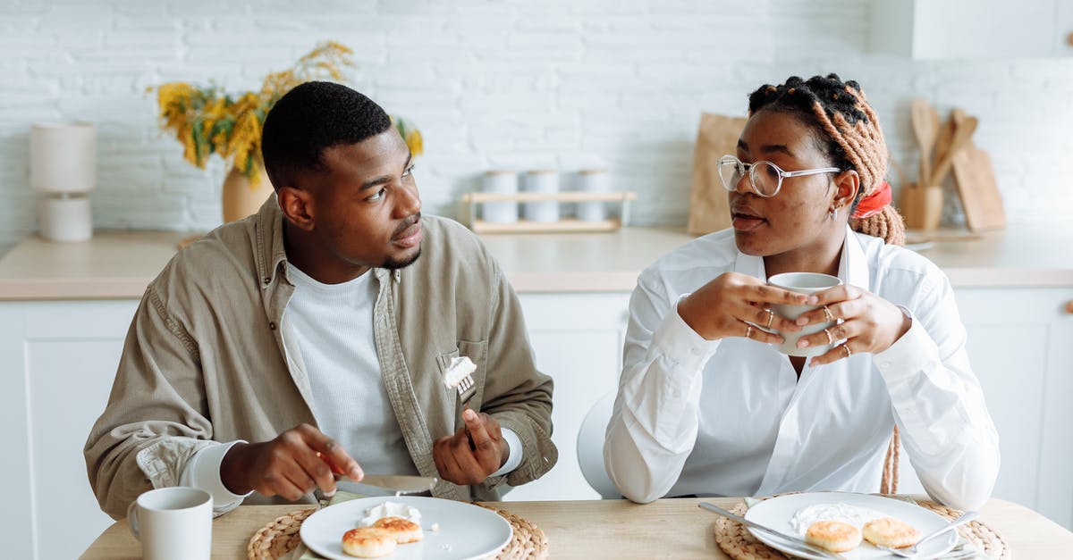 Is eating soap or bleach dangerous? - Man in White Dress Shirt Sitting Beside Woman in White Long Sleeve Shirt