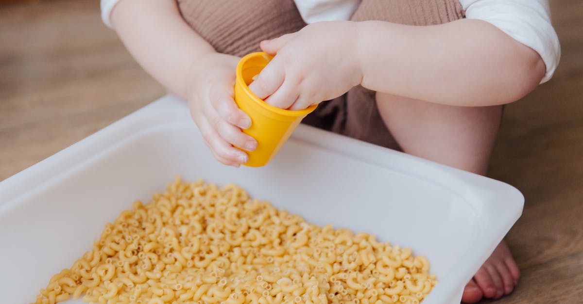 Is fresh pasta just good marketing? [closed] - Person Holding Yellow Plastic Container