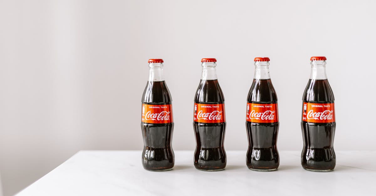 Is granulated sugar (American) the same as caster sugar (UK)? - Glass bottles of cola on white table