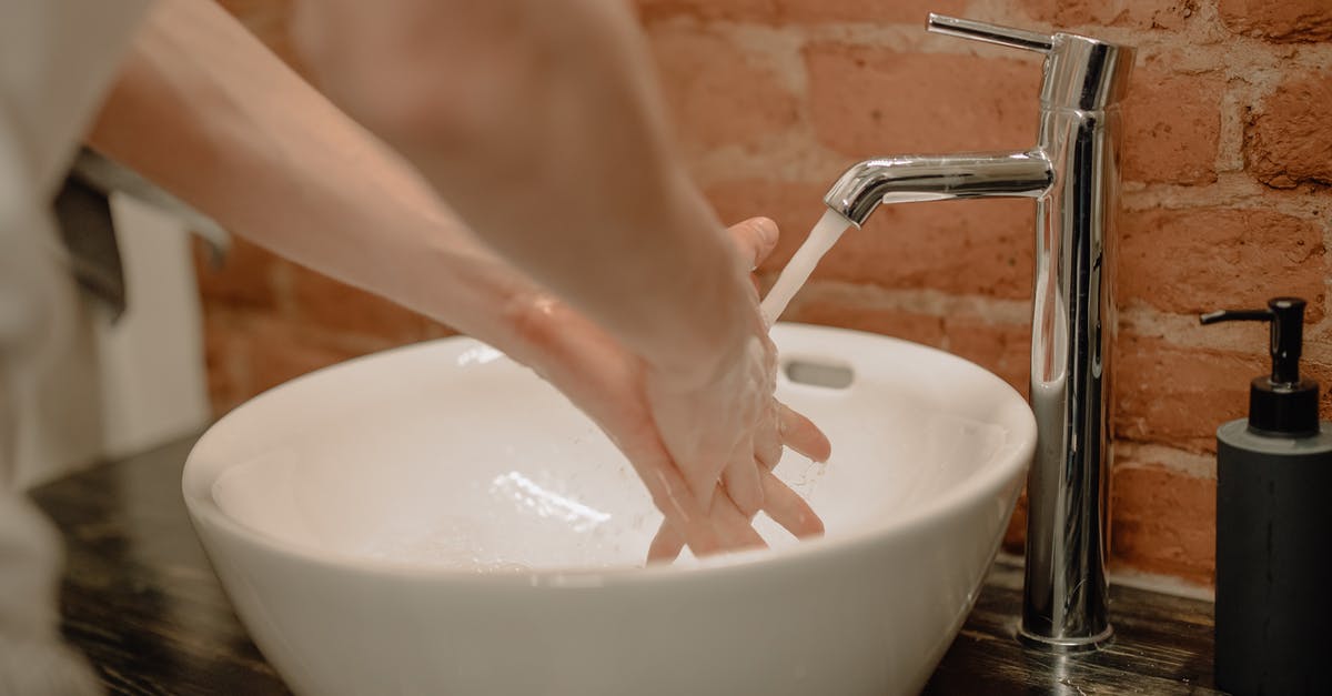 Is hot tap water safe for cooking? - Person Washing Hands