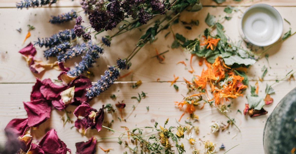 Is it a good idea to grind dried oregano with a mortar and pestle? - Dried flowers and Petals on a Wooden Table