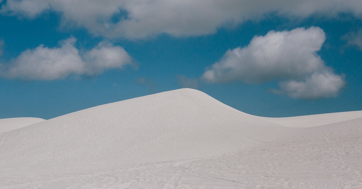 Is it bad to heat empty pans? - From below of pure blue sky with clouds over empty endless desert landscape with wheels and shoes tracks on surface