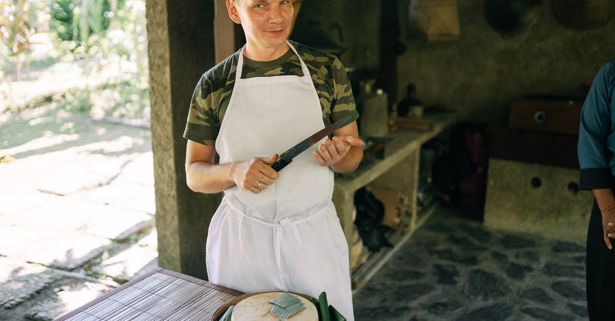 Is it feasible to cook via a forge? - Man Standing with Knife over Cheese